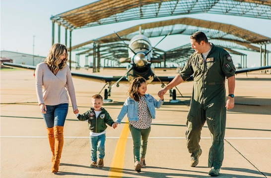 Major Kinsley Jordan and family at an airfield