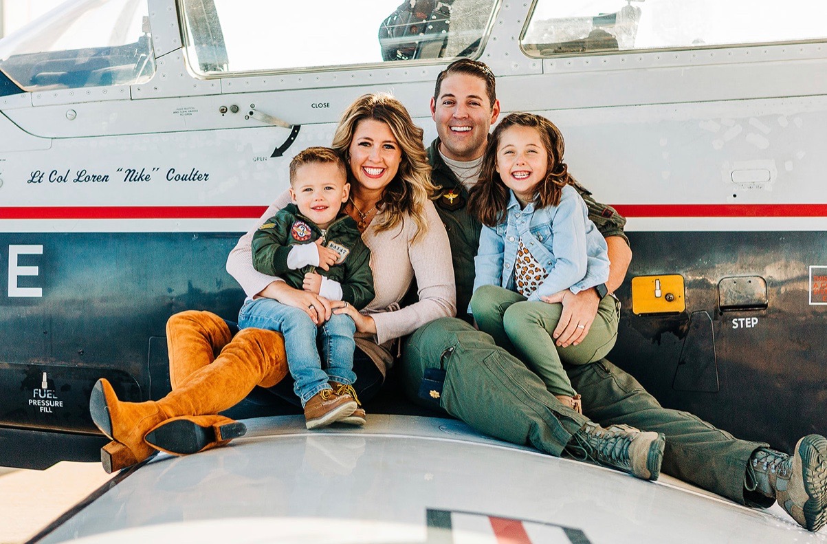 Major Kinsley Jordan with his wife Brooke and their children at the airfield