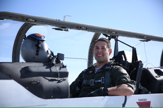 Major Kinsley Jordan near an aircraft